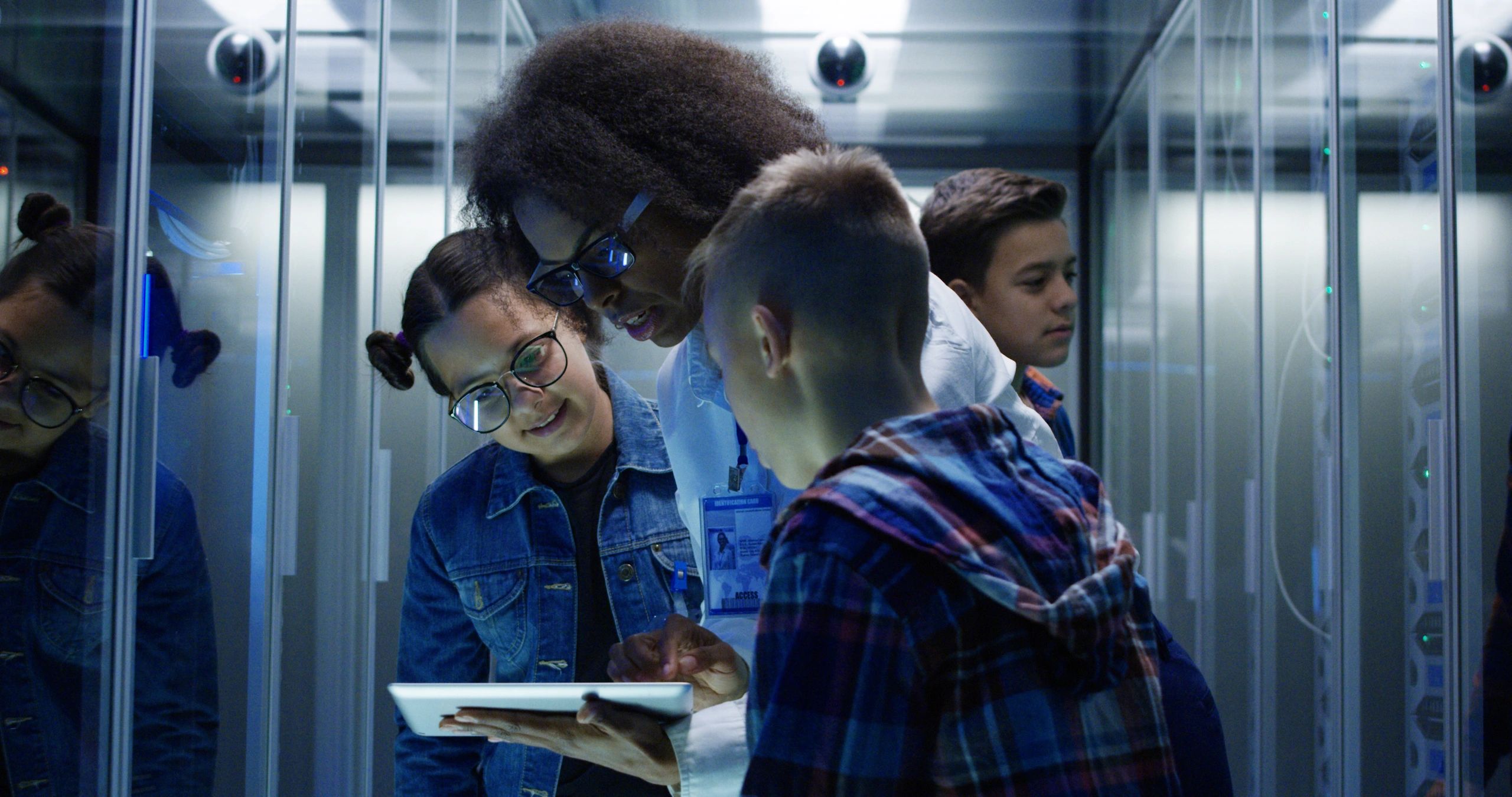 Technical team in a modern lab environment collaborating around advanced equipment
